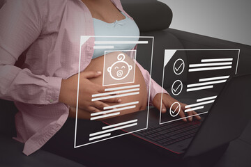 Concept business, pregnant woman looking at a checklist on the internet sitting on a couch, laptop o legs