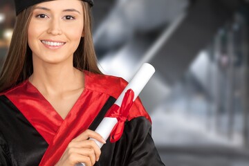 portrait of young graduate student with hat