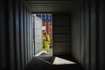 Foreman containers cargo inspector working. Cargo freight ship for import export. concept shipping, business and transportations.