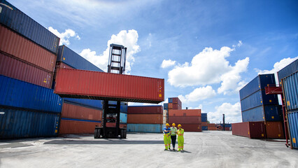 Manager standing and meeting with his staff in container depo company area. worker working checking at Container cargo harbor to loading containers.