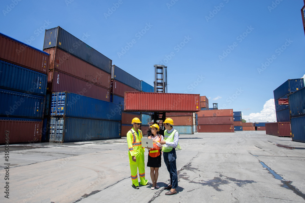 Aufkleber manager standing and meeting with his staff in container depo company area. worker working checking 