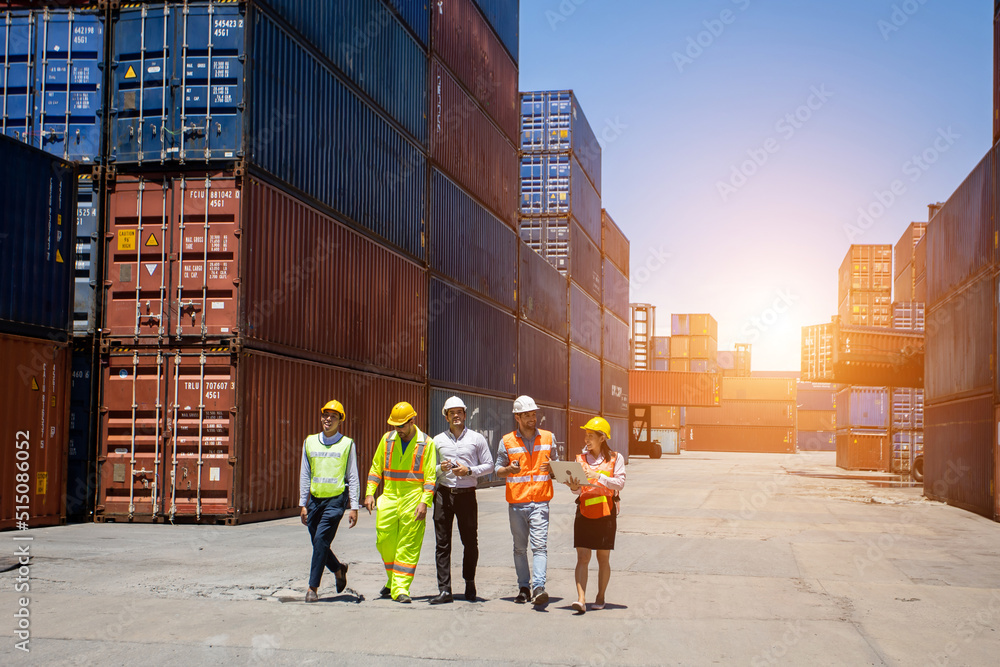 Aufkleber group workers people in safety uniforms and hard hats work at logistics terminal with many stacks of
