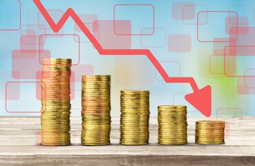 Stack of coins bar chart and graph trending downwards. Economy recession crisis, inflation, stagflation, business and financial loss concept.