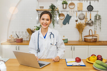 Asian teacher female nutritionist advises about eating health Define diets work kitchen studios diet plans medical weight loss or video call interested parties and consult online in live broadcasts.