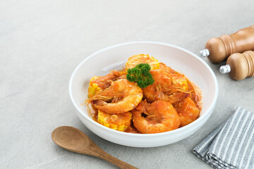 Udang Saus Padang (Shrimp in Chili Sauce), traditional food from Padang, Indonesia. Served in white bowl.

