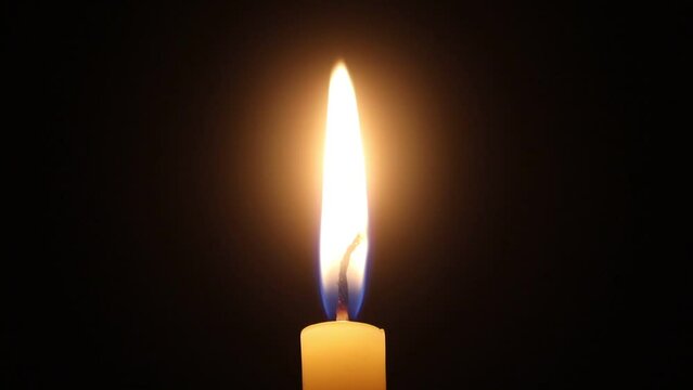 Candle light on black backround