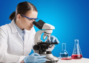 Students working in the clinical laboratory, a researcher is using a microscope, scientific research concept