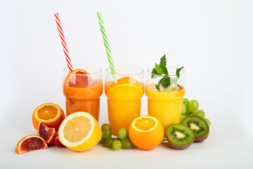 Fruit juices assortment on light background.