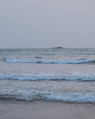 Multiple waves hitting to the beach