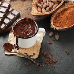 Melted chocolate drink on dark background.