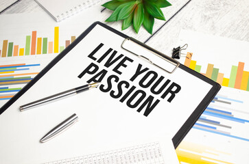 LIVE YOUR PASSION text on file folder and charts on wooden background