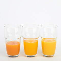 Fruit juices assortment on light background.