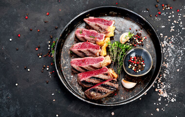 Fototapeta na wymiar Grilled beef steak with pepper and salt.