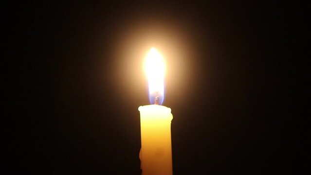 Candle light on black backround