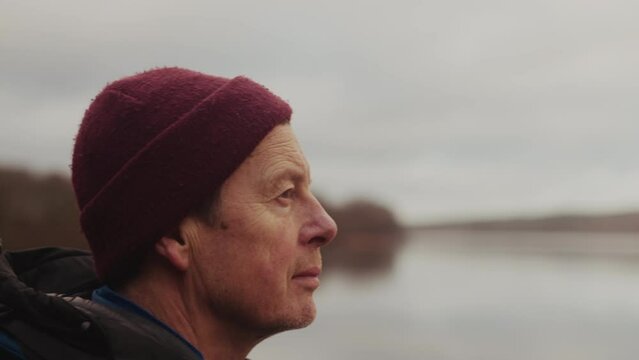 Close-up Portrait of Man Tourist Looking at Lake in Himmelbjerget Area, Denmark