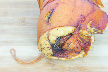 roll from lard and meat from a pig's neck close-up