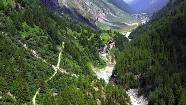 Drone flight from the direction of Zinal glacier through the valley through towards the village of Zinal in Valais, Switzerland.