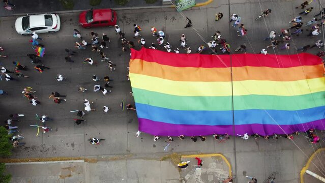 flag of the LGBT community makes its way through the city announcing the rights of gays and lesbians during the month of pride