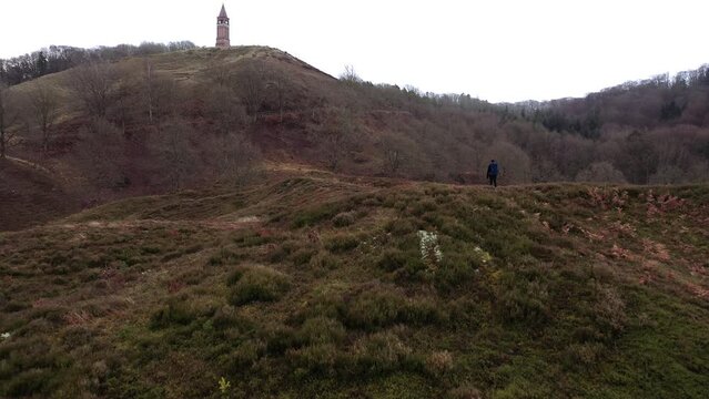 Aerial of a Tourist Hiking Along the Hills in Himmelbjerget Area, Denmark