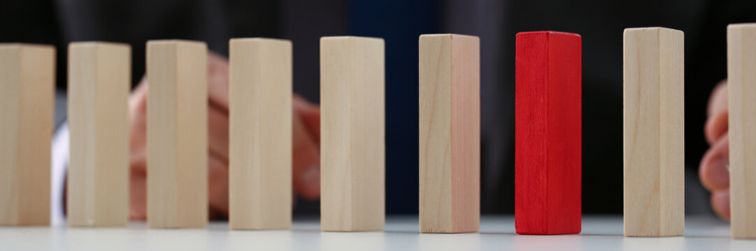 Businessman Choose Red Wood Block Over Simple Similar Wooden Cubes