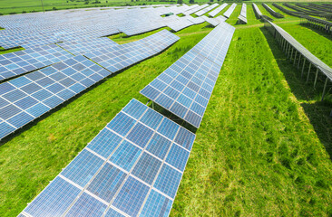 Aerial view with a big solar panel field plant on top of the hills. Summer industrial landscape...