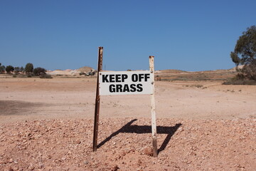 Sign on the Coober Pedy golf course in the remote outback of South Australia.