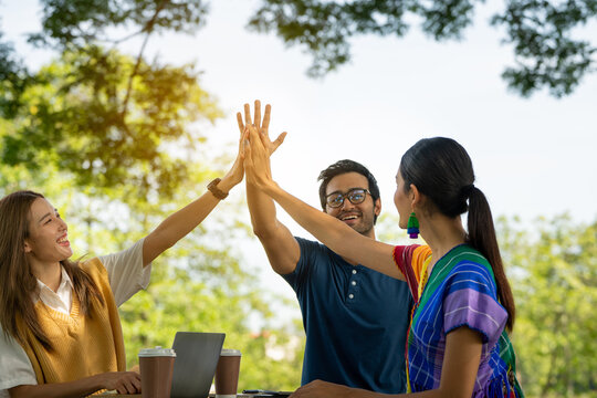 Trust Partnership.Young Happy Friend Partner People Trust Cheerful Hands Up Successful Group Team Work. Diverse LGBTQ Culture Students Celebrating Together. Group Of People Supporting Each Others.