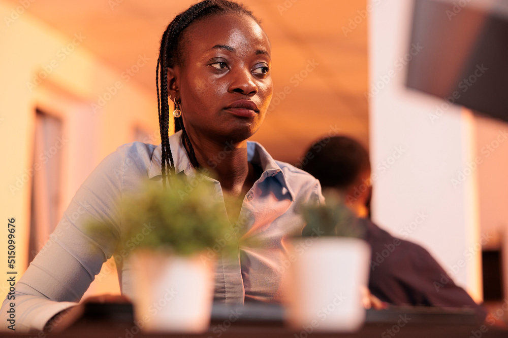 Poster confident female freelancer analyzing research data on computer at office job, working with executiv