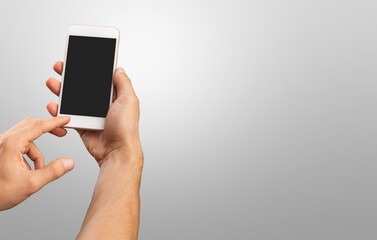 Hand holding the smartphone with blank screen