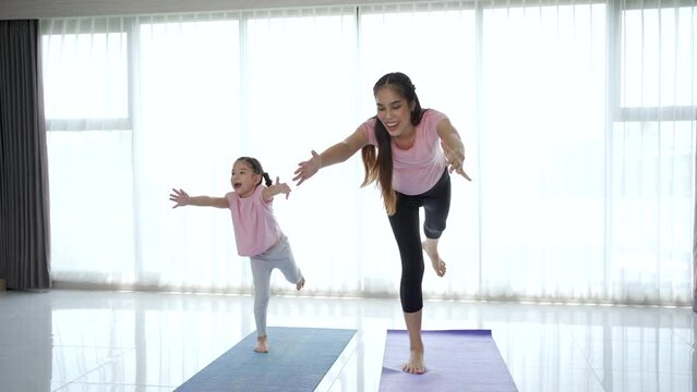 Asian family making an exercise together.