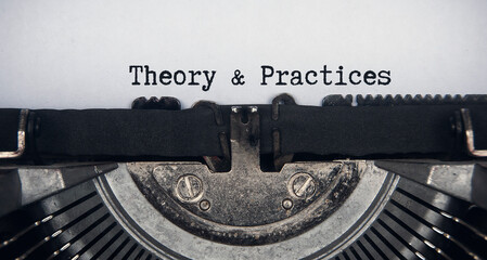 Theory and practices text typed on an old vintage typewriter. Conceptual