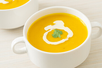 pumpkin soup in white bowl