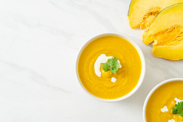 pumpkin soup in white bowl