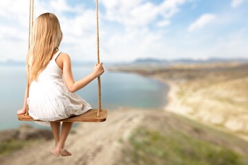 Traveler girl relaxing on swing above sea beach, Leisure tourist travel summer holiday vacation trip, Happy dream concept