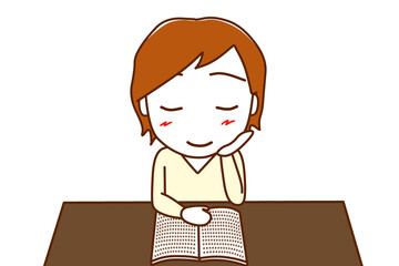 （上半身正面）机に座って本を楽しく読んでいる白人男性