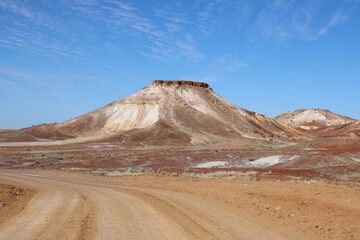 Dirt road in the Kanku-Breakaways Conservation Park near he remote outback opal mining town of Coober Pedy, South Australia.