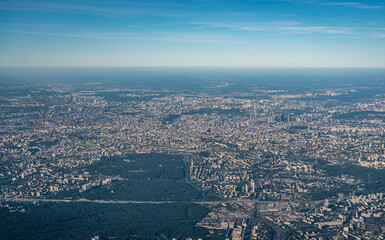 Aerial view photo from airplane of city and clear sky. aerial photo of large city from an airplane window. view of city through window from plane