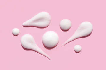 texture foam mousse foam cosmetic smear sample on pink background