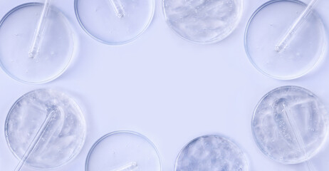 banner glass pipette serum gel closeup in petri dish on a light background