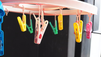 Clothespins for drying wet and washed clothes. Colorful clothespins.