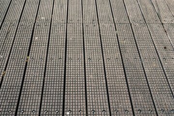 Fototapeta premium Foot path with special anti slip surface. Safety in a public place.