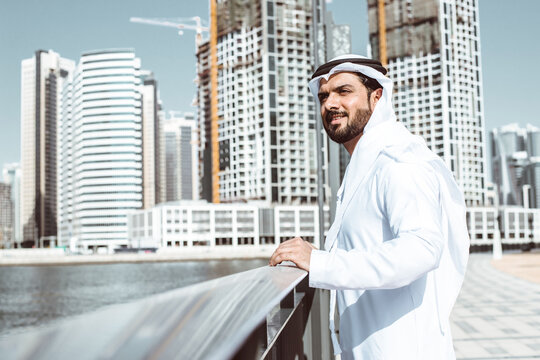 Arabic businessman looking at the skyline in Dubai