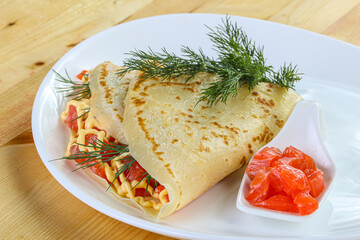 Pancake with salmon fiilet and cheese
