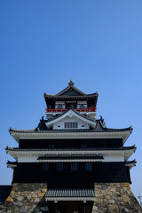 Scenery of Kiyosu Castle with blue sky background. Japanese castle located in Kiyosu, eastern Aichi Prefecture.