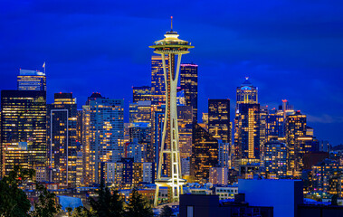 City skyline view with the Space Needle and Mount Rainier at sunset in Seattle