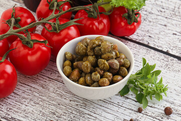 Marinated green capers in the bowl