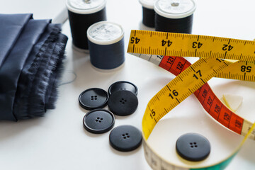 Sewing items and seamstress tools. Tailoring measuring tape, rulers, pins, buttons, fabric 