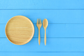 Intermittent fasting, diet and weight loss concept : Wood dish, a pair of spoon and fork....