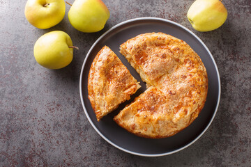 Delicious apple cheddar pie with crispy crust close-up on a plate on the table. horizontal top view from above