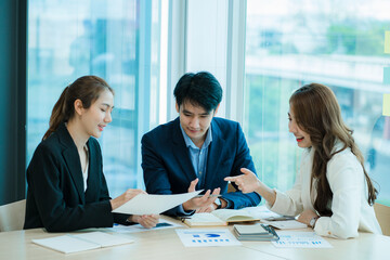 small group of young people at a business meeting a team in a modern office planning of work design and brainstorming ideas Hands of a businessman working on documents and laptops 